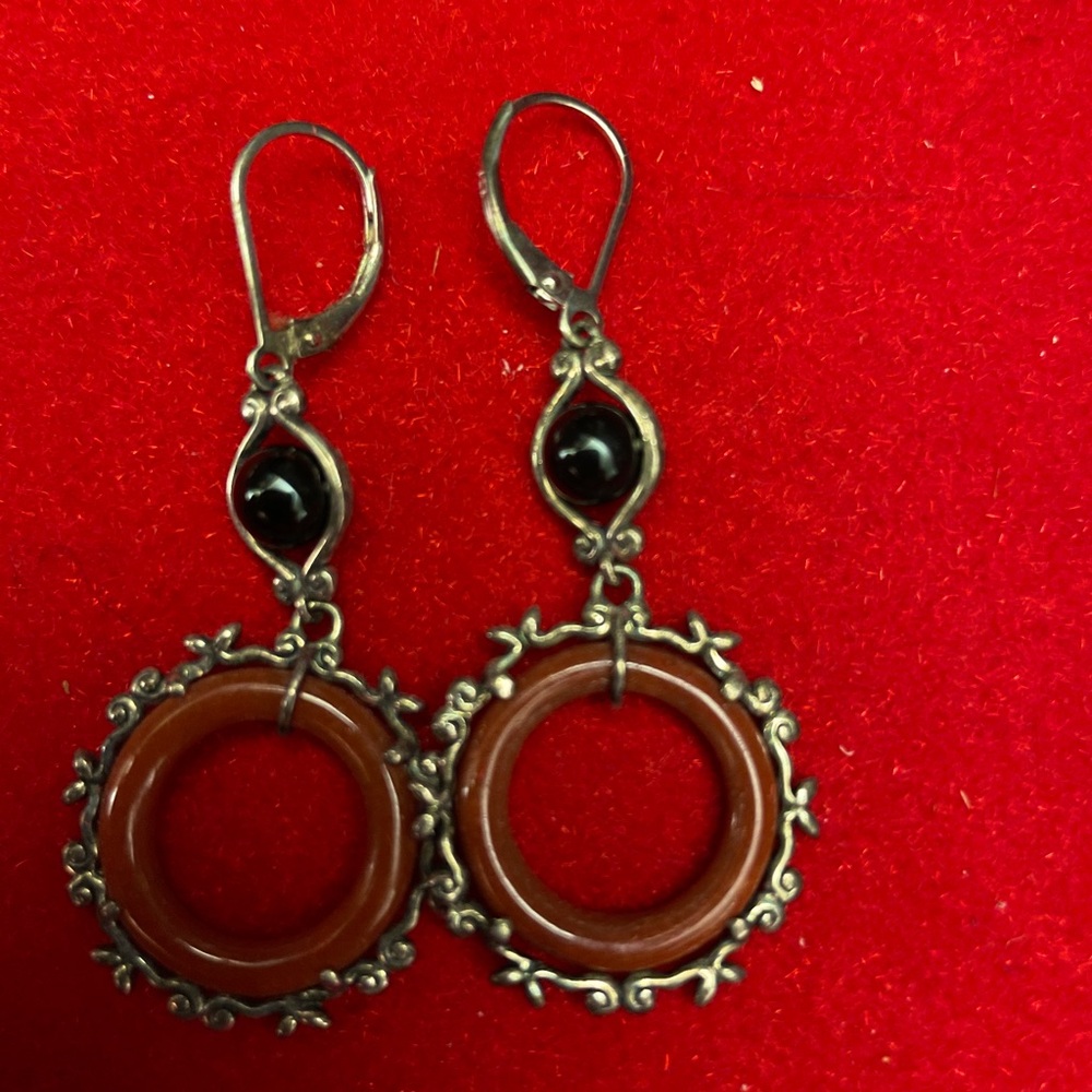 Sterling silver and jade earrings.
